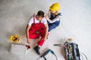 A female employee calls a Cary workplace injury lawyer for her injured coworker.
