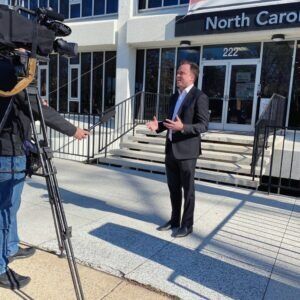 Whitley Law Firm staff in front of camera