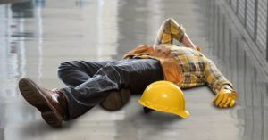 injured construction worker lying on the floor after a fall
