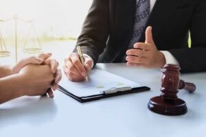 A client and their construction accident lawyer discuss filing a lawsuit.