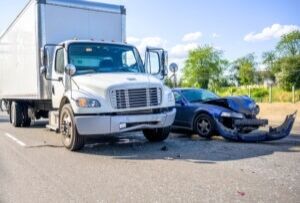 The photo shows a crash. Who is liable for a truck accident in North Carolina?